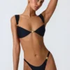 Slip Bikini con parti inferiori decorate Volute in nero Slip Bikini con parti inferiori decorate Volute in nero