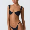Slip Bikini con parti inferiori decorate Volute in nero Slip Bikini con parti inferiori decorate Volute in nero