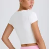 T-shirt corta in jersey di cotone elasticizzato con stampa grafica in bianco