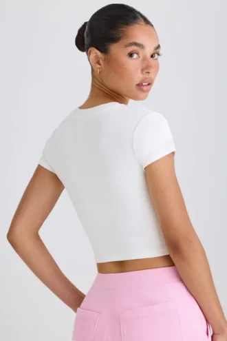 T-shirt corta in jersey di cotone elasticizzato con stampa grafica in bianco