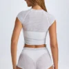 T-shirt corta trasparente con arricciature Santana in bianco T-shirt corta trasparente con arricciature Santana in bianco