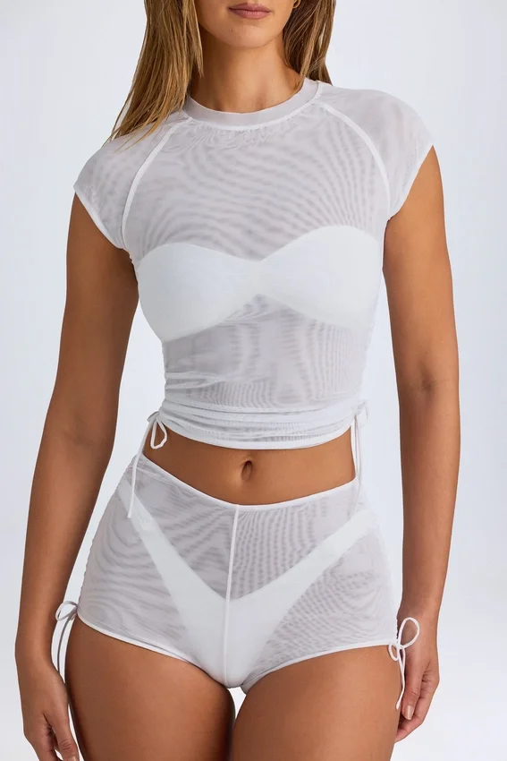 T-shirt corta trasparente con arricciature Santana in bianco T-shirt corta trasparente con arricciature Santana in bianco