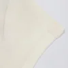 T-shirt lunga con cut-out color crema T-shirt lunga con cut-out color crema