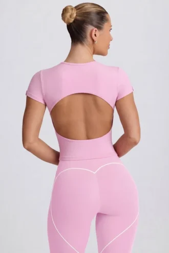 T-shirt lunga con cut-out in rosa antico