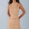 Top a collo alto in ecopelle scamosciata Aurelle colore beige Top a collo alto in ecopelle scamosciata Aurelle colore beige
