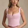 Top a corsetto allacciato Nami in rosa tenue Top a corsetto allacciato Nami in rosa tenue