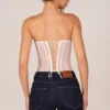 Top a corsetto con allacciatura a fascia Zoa in avorio