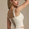 Top a corsetto con allacciatura Nami in avorio Top a corsetto con allacciatura Nami in avorio