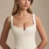 Top a corsetto con allacciatura Nami in avorio Top a corsetto con allacciatura Nami in avorio