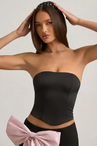 Top a corsetto con cut-out e fiocco Audrina in nero