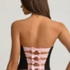 Top a corsetto con cut-out e fiocco Audrina in nero Top a corsetto con cut-out e fiocco Audrina in nero