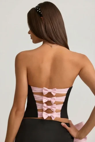 Top a corsetto con cut-out e fiocco Audrina in nero