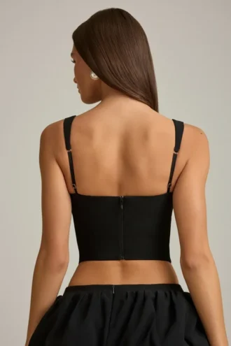 Top a corsetto con cut-out e fiocco Pearla in nero