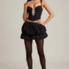 Top a corsetto con cut-out e fiocco Pearla in nero Top a corsetto con cut-out e fiocco Pearla in nero
