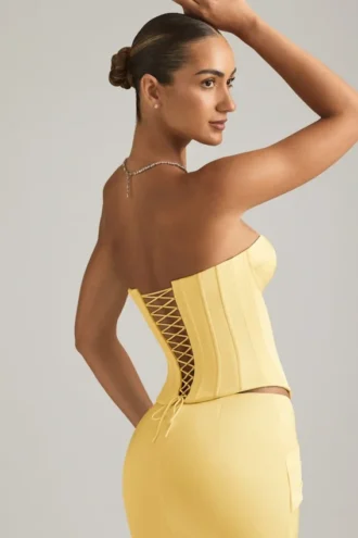 Top a corsetto con lacci Araminta in giallo pastello