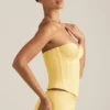 Top a corsetto con lacci Araminta in giallo pastello