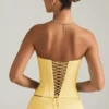 Top a corsetto con lacci Araminta in giallo pastello