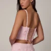 Top a corsetto con lacci decorati Letitia in rosa tenue Top a corsetto con lacci decorati Letitia in rosa tenue