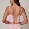 Top a corsetto con lacci decorati Letitia in rosa tenue Top a corsetto con lacci decorati Letitia in rosa tenue