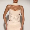 Top a corsetto con lacci e decorazioni Junelle con sciarpa in oro
