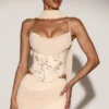Top a corsetto con lacci e decorazioni Junelle con sciarpa in oro