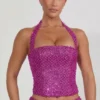 Top a corsetto con scollo all’americana e decorazioni Caralie in magenta