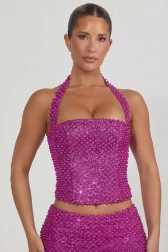 Top a corsetto con scollo all’americana e decorazioni Caralie in magenta