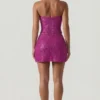 Top a corsetto con scollo all’americana e decorazioni Caralie in magenta
