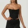 Top a corsetto drappeggiato con decorazioni in argento sterling, nero