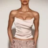 Top a corsetto drappeggiato con lacci in raso Yulea, colore oro Top a corsetto drappeggiato con lacci in raso Yulea, colore oro