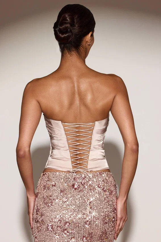 Top a corsetto drappeggiato con lacci in raso Yulea, colore oro Top a corsetto drappeggiato con lacci in raso Yulea, colore oro