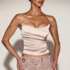 Top a corsetto drappeggiato con lacci in raso Yulea, colore oro Top a corsetto drappeggiato con lacci in raso Yulea, colore oro