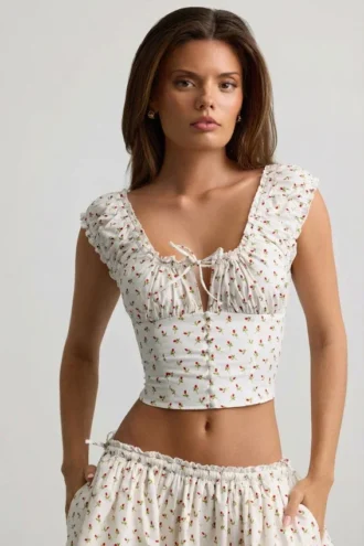 Top a corsetto in popeline di cotone arricciato Faela con stampa di rose