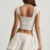 Top a corsetto in popeline di cotone arricciato Faela con stampa di rose