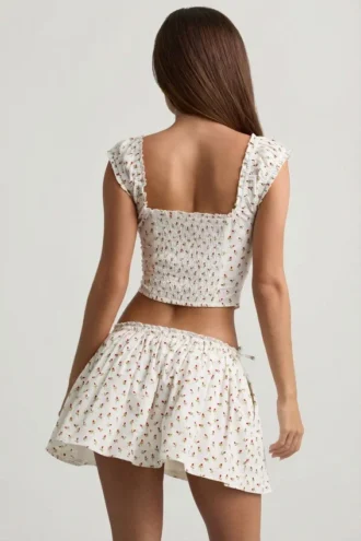 Top a corsetto in popeline di cotone arricciato Faela con stampa di rose