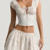 Top a corsetto in popeline di cotone arricciato Faela con stampa di rose
