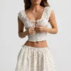 Top a corsetto in popeline di cotone arricciato Faela con stampa di rose