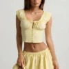 Top a corsetto in popeline di cotone arricciato Faela in giallo limone Top a corsetto in popeline di cotone arricciato Faela in giallo limone
