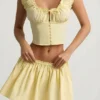 Top a corsetto in popeline di cotone arricciato Faela in giallo limone Top a corsetto in popeline di cotone arricciato Faela in giallo limone