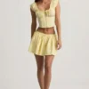 Top a corsetto in popeline di cotone arricciato Faela in giallo limone Top a corsetto in popeline di cotone arricciato Faela in giallo limone