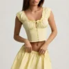 Top a corsetto in popeline di cotone arricciato Faela in giallo limone Top a corsetto in popeline di cotone arricciato Faela in giallo limone