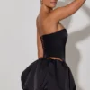 Top a corsetto senza spalline con cut-out a cuore decorato Amora in nero Top a corsetto senza spalline con cut-out a cuore decorato Amora in nero