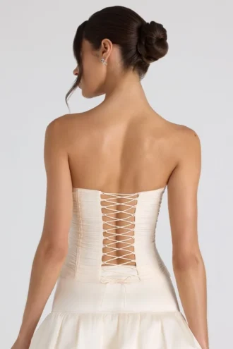 Top a corsetto senza spalline con lacci e ruches Melvina in avorio