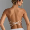 Top a fascia con spalline incrociate sul retro e decorazioni Nanaka in bianco