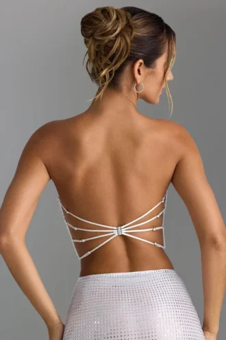 Top a fascia con spalline incrociate sul retro e decorazioni Nanaka in bianco