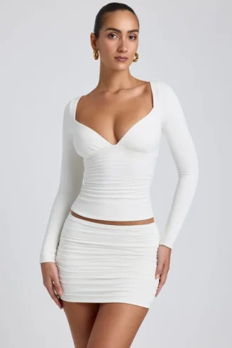 Top a maniche lunghe con arricciature in modal Emry, colore bianco