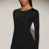 Top a maniche lunghe con collo rotondo e decorazioni Venia in nero Top a maniche lunghe con collo rotondo e decorazioni Venia in nero