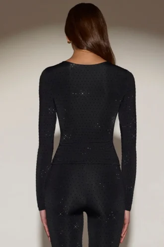 Top a maniche lunghe con collo rotondo e decorazioni Venia in nero
