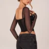 Top a maniche lunghe con corsetto Zella in nero Top a maniche lunghe con corsetto Zella in nero