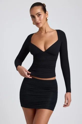 Top a maniche lunghe con ruches Emry in modal nero
